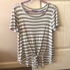 Boutique top with trendy front tie.